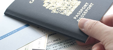 Man-showing-his-canadian-passport-at-philippine-consulate-toronto-for-filipino-immigration-requirement-in-family-sponsorship